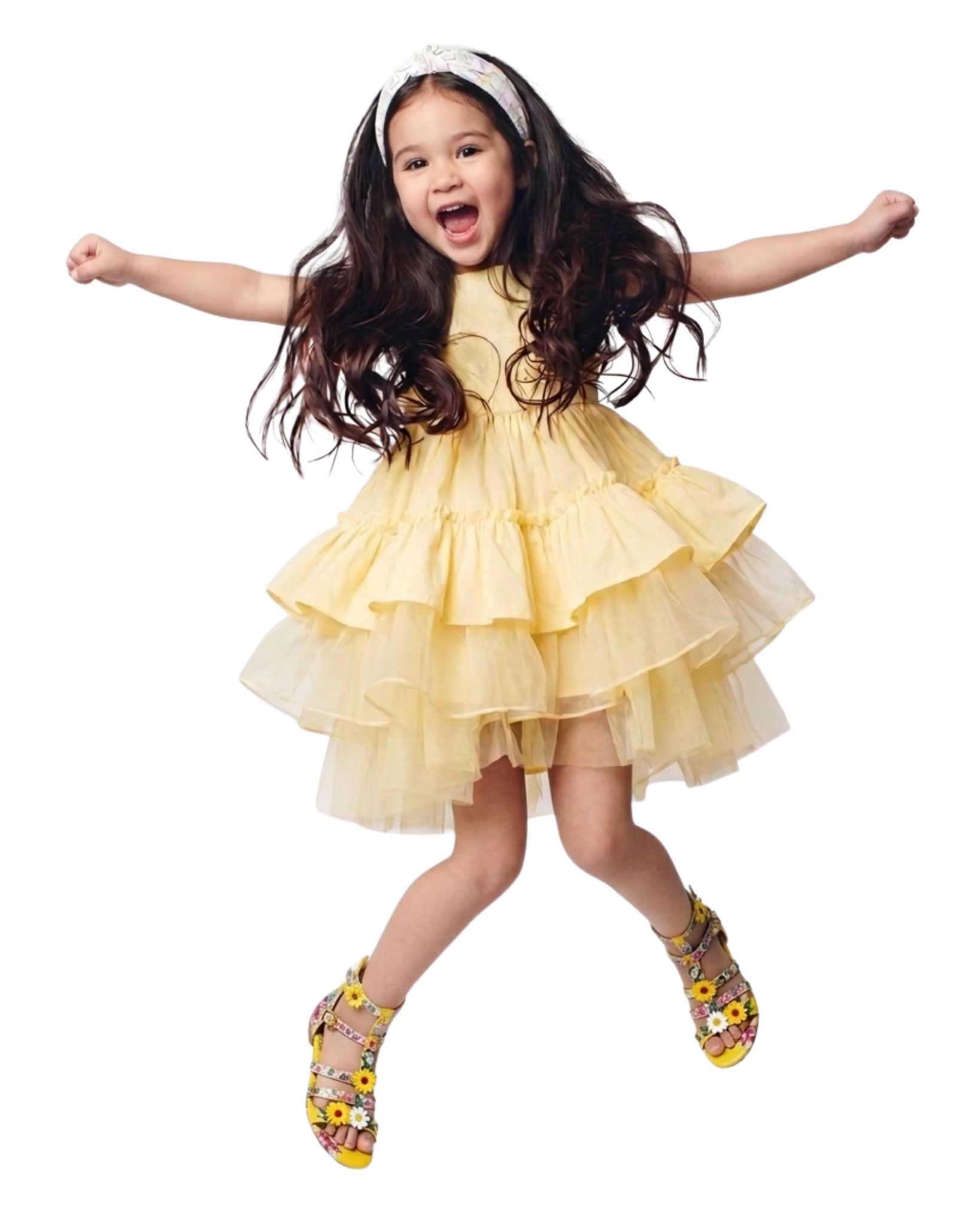 Girl jumping in a yellow dress